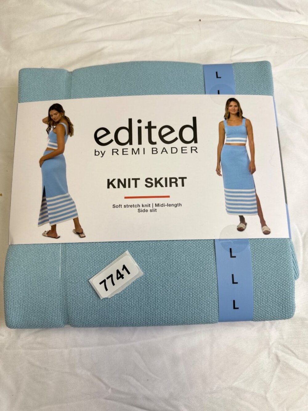 Edited by remi bader  knit skirt soft stretch knit mid length slit side. New